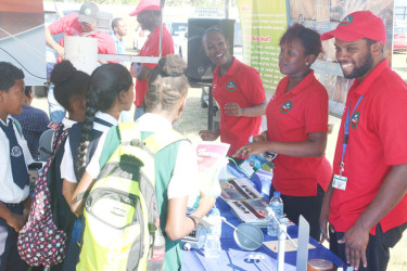 Schoolchildren engaging staff at the Hydromet Office’s booth at the World Food Day Agricultural Fair at the Uitvlugt Community Centre Ground  