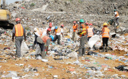 Waste pickers sorting through garbage dumped at Haags Bosch (Stabroek News file photo)