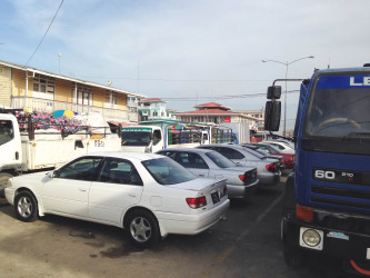Essequibo trucks waiting at the stelling with the taxis in the centre