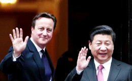 China's President Xi Jinping is welcomed by Britain's Prime Minister David Cameron to 10 Downing Street, in central London, Britain, October 21, 2015. Reuters/Suzanne Plunkett
