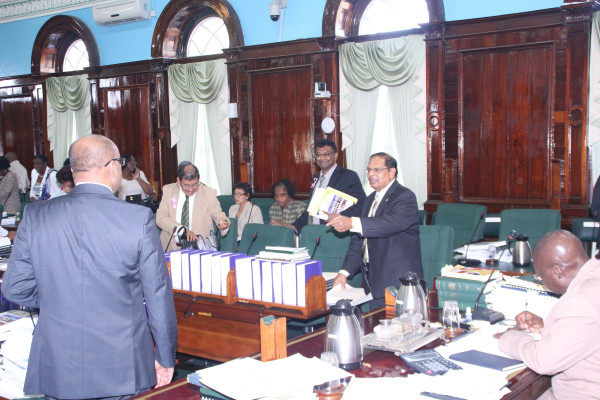 Prime Minister Moses Nagamootoo (right) and Opposition Leader Bharrat Jagdeo (left) bantering about salary hikes and pensions in parliament yesterday.  