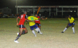 Royan Morrison (no.15) of Pele FC in the process of challenging Dwayne Lawrence (no.20) of Alpha United for possession of the ball during their matchup in the GFF Stag Beer Elite League at the Camp Ayanganna ground.