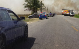 Motorists who were disrupted by the smoke from the rice fields. (Photo courtesy of Sahadeo Bates)