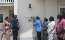 Prime Minister Moses Nagamootoo unveils the plaque for the opening of the Demerara Paradise Inc Nursing Home. Also in picture are (from left) Directors Dr Carolina Bridgemohan, Dr Vivekanand Bridgemohan, Mrs Sita Nagamootoo, Junior Public Health Minister Dr Karen Cummings and Social Protection ministerial advisor John Adams.