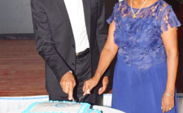 President David Granger and UN Resident Represen-tative Khadija Musa cutting a cake to mark the ceremony (Ministry of the Presidency photo)
