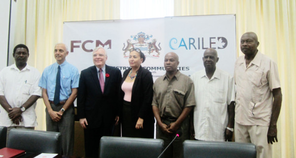Minister of Communities Ronald Bulkan (second from left) and Canadian High Commissioner Pierre Giroux (third from left) with representatives from five of the six municipalities in Guyana.