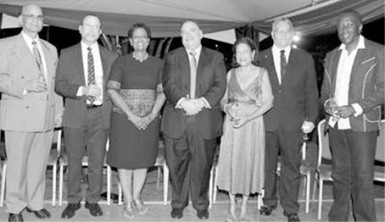 UWI honorary graduates 2015, from left, Rajkumar “Krishna” Persad, Degree of Doctor of Letters (DLitt); Gerard Besson, Doctor of Letters (DLitt); Marjorie Thorpe, Doctor of Letters; Norman Sabga, Doctor of Letters; Justice Jean Angela Permanand, Doctor of Laws (LLD); Hollis Raymond Charles, Degree of Doctor of Science (DSc), and David Michael Rudder, Doctor of Letters.  The grads were guests of honour at a reception hosted by UWI St Augustine Campus Prof Clement Sankat at the office of the campus principal on Friday.  PHOTO: ANDRE ALEXANDER