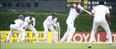 West Indies batsman Darren Bravo punches a delivery delightfully on the way to his top score of 61 but his innings was not enough to see the West Indies to their first test win in Sri Lanka. (Photo courtesy WICB media) 