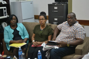 Minister within the Ministry of Public Health Dr. Karen Cummings (left) along with Dr.  Nathilee Caldeira (centre) and a member of her team (GINA photo)   