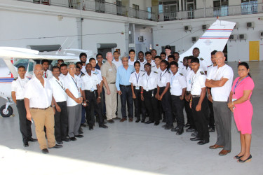 Officials of the Ministry of Education, RAM and the school in front of the aircraft. (Ministry of Education photo) 