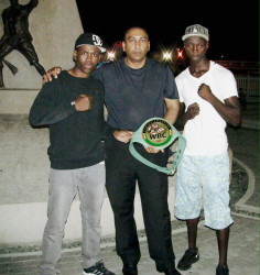 Vice President of NexGen Global Marketing Services Inc. Aleem Hussain (centre) is seen posing with the ‘Caribbean Knockdown’ card headliners Clive Atwell and Dexter Gonsalves prior to the fight last Saturday at the Giftland Mall. 