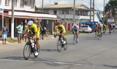 Carlos Ospina sprints to victory ahead of his Team Coco’s club mate, Darren Matthews and Alanzo Greaves to win the first stage from Corriverton to New Amsterdam. (Orlando Charles photo) 