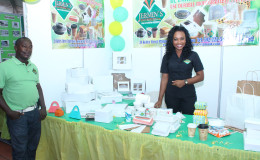 Assistant Manager of Jermin’s Enterprise displaying the wide range of biodegradable disposable food containers at yesterday’s expo.