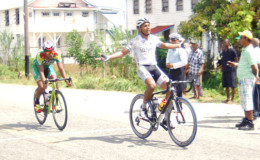 Alanzo Greaves celebrates his stage win yesterday ahead of fellow national rider, Geron Williams.