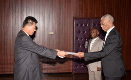 Newly accredited Non-resident Ambassador from the Democratic People’s Republic of Korea, Pak Chang Yul (left), as he presented his Letters of Credence to President David Granger, earlier today, at the Ministry of the Presidency (GINA photo)
