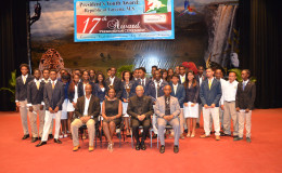 President David Granger (center) and Junior Minister Nicolette Henry (seated second from left) with the 48 participants that received the gold award under the President’s Youth Award: Republic of Guyana programme, at the National Cultural Centre yesterday. 