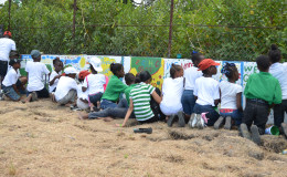 Students painting on the wall
