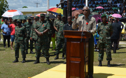 President Granger addressing the troops with the senior officers behind him. 
