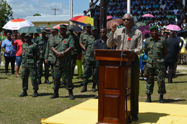 President Granger addressing the troops with the senior officers behind him. 