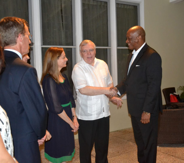 Minister of State, Joseph Harmon (right)  shares a light moment with Canadian High Commissioner to Guyana, Pierre Giroux and his wife, Bianca Giroux.  (Ministry of the Presidency photo)