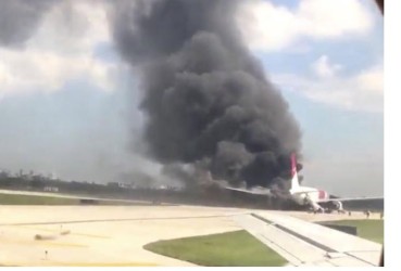 
A still image from a handout video footage by Mike Dupuy, a passenger in another airplane, shows Dynamic International Airways' Boeing 767's engine on fire in Fort Lauderdale, Florida, October 29, 2015.
Reuters/Mike Dupuy
