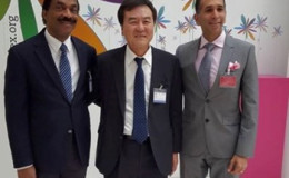 Attorneys General of Guyana and Trinidad and Tobago Basil Williams (left) and Faris Al Rawi (right) with President of the Financial Action Task Force Je-Yoon Shin at OECD Headquarters in Paris, France (GINA photo)