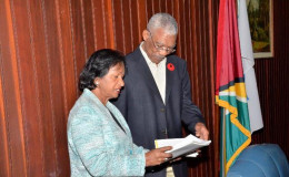 Chairperson of the Women and Gender Equality Commission, Indra Chandarpal handing over the Commission's annual report as well as its five- year strategic plan to President David Granger. (GINA photo)
