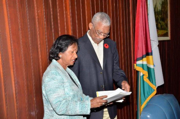 Chairperson of the Women and Gender Equality Commission, Indra Chandarpal handing over the Commission's annual report as well as its five- year strategic plan to President David Granger. (GINA photo)