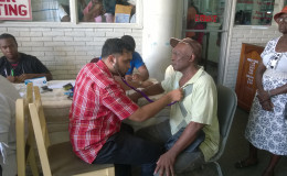 This photo shows a pensioner being examined.