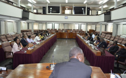 A parliamentary delegation from Guyana last week visited Suriname for talks with its counterparts. Here the two delegations can be seen in the Plenary Meeting Room of the Surinamese Parliament. (Guyana Parliament Office photo)