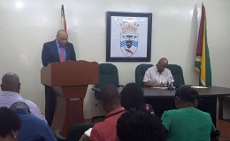 Minister of Governance Raphael Trotman speaking at today's press conference (Ministry of the Presidency photo)