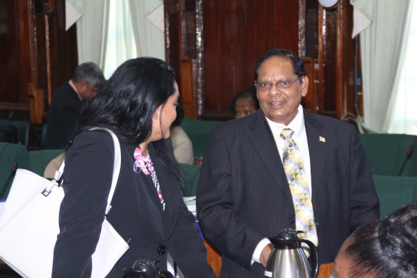 Prime Minister Moses Nagamootoo (right) in conversation with PPP/C MP Vindhya Persaud in parliament yesterday.