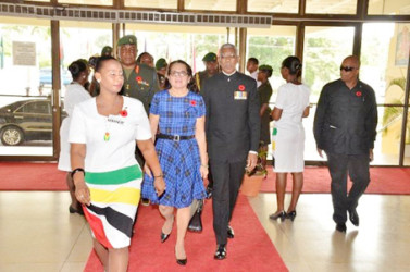 President David Granger and First Lady Sandra Granger being ushered into the National Cultural Centre for the Guyana Defence Force’s 50th anniversary church service  (GINA photo)