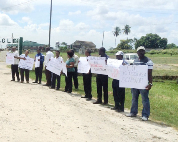 NAACIE, GAWU and GLU representatives picket outside of GuySuCo’s head office at Ogle.