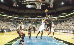  Minneapolis, MN, USA; Miami Heat guard Dwyane Wade (3) goes up for a layup past Minnesota Timberwolves guard Kevin Martin (23) in the second half at Target Center. The Heat won 96-84. Mandatory Credit: Jesse Johnson-USA TODAY Sports.