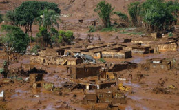 The Bento Rodrigues district is pictured covered with mud after a dam owned by Vale SA and BHP Billiton Ltd burst in Mariana, Brazil, yesterday.  Reuters/Ricardo Moraes
