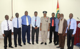  Public Security Minister Khemraj Ramjattan and Police Commissioner Seelall Persaud (both at centre) with members of the Guyana Police Force Fallen Heroes Foundation Inc.
