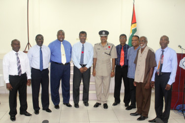  Public Security Minister Khemraj Ramjattan and Police Commissioner Seelall Persaud (both at centre) with members of the Guyana Police Force Fallen Heroes Foundation Inc.  