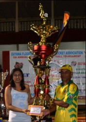 MVP in the open category Richard Latiff receives his trophy from Devi Sunich. 