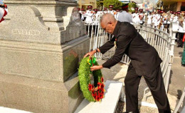 President David Granger as he lays a wreath in remembrance of those who paid the ultimate sacrifice during World Wars I and II. (GINA photo)