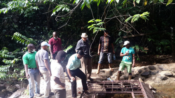The Guyana Water Incorporated team examining sections of the Mahdia water supply system. (GWI photo)