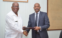 Minister of Finance Winston Jordan (left) and CEO of the Caricom Development Fund Rodinald Soomer following the signing of the loan agreement. (GINA photo) 