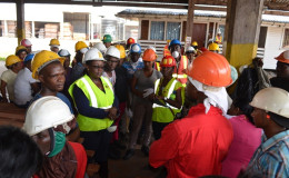 Minister Simona Broomes engaging workers