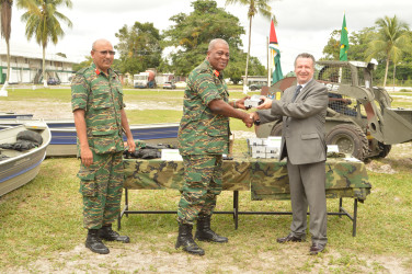 Brazilian Ambassador, Lineu Pupo De Paula (right) making the handover to Chief of Staff Mark Phillips. (GDF photo) 