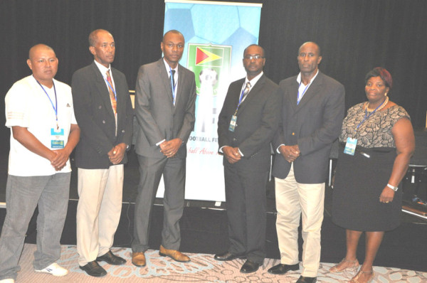 The newly elected GFF Executive Committee from left to right- Brian Rodrigues, Keith O’Jeer, Deon Innis, Wayne Forde, Bruce Lovell and Magzene Stewart pose for the camera following their 12-10 win over the Nigel Hughes led ‘Team Unity’ slate at the federation’s electoral congress. Absent from the picture are executives Rawlston Adams and Attorney-at-Law Thandi McAllister. 