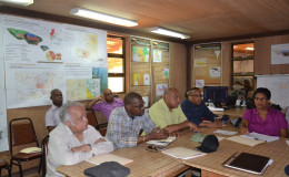 From left seated at table are Sir Shridath Ramphal; Minister of Public Infrastructure, David Patterson; Minister of Governance, Raphael Trotman and Ministerial Advisor to Minister Patterson, Kenneth Jordan listening to a presentation which was made on the company’s operations.  (Ministry of the Presidency photo)