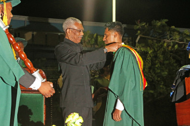 Sachin Ramsuran being conferred with the President’s Medal by President David Granger 