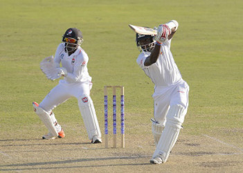Shamarh Brooks drives through the off-side during his unbeaten 51 against Red Force yesterday. (Photo courtesy WICB Media) 