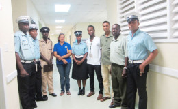 Members of the Guyana National Road Safety Council (GNRSC) and ranks from the Traffic Headquarters yesterday during their visit to accident victims at the Georgetown Public Hospital. At centre (from left) are Assistant Superintendent Henry and Ramona Doorgen, GNRSC Coordinator.
