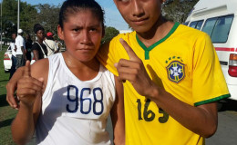 Winner’s row! District 9 and District 1 athletes, Beverley Ignacio and Recky Williams pose for a photo following their 10k victories yesterday in the National Park.